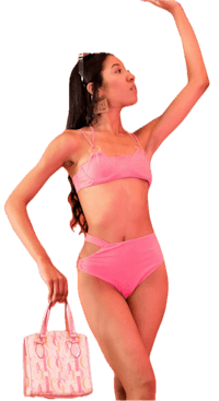 a woman in a pink bikini holding a pink purse